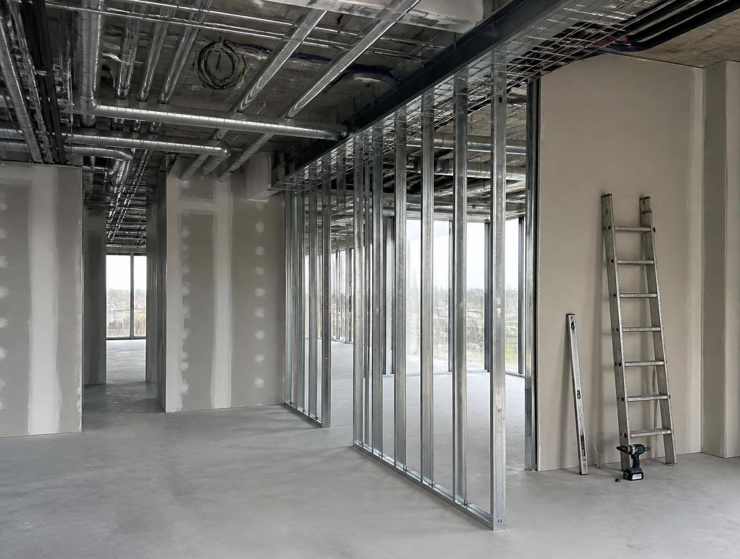 Commercial fit-out works in progress with partition framing and services