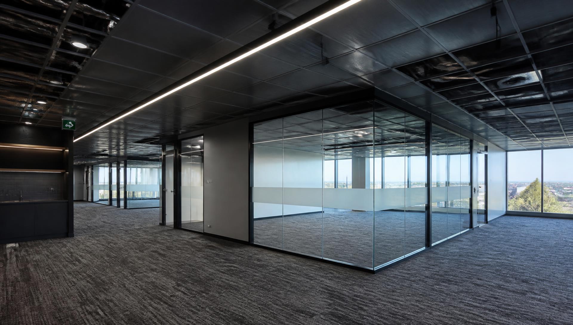 Refurbished commercial office interior with glazed partitions